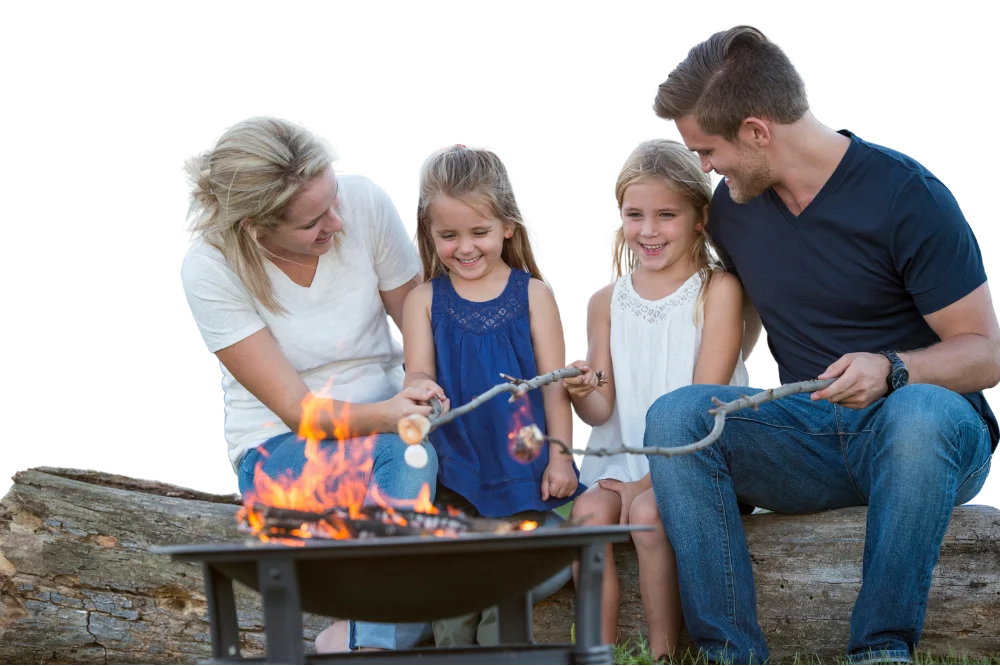 Family camping roasting marshmallows