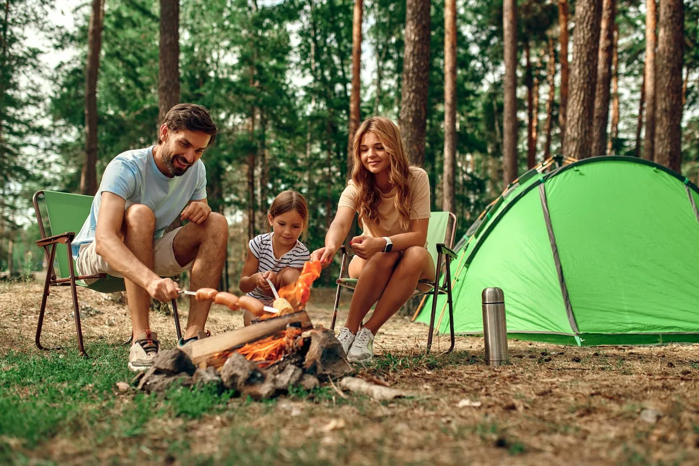 Family on vacation in the forest, framed by the outline of Texas